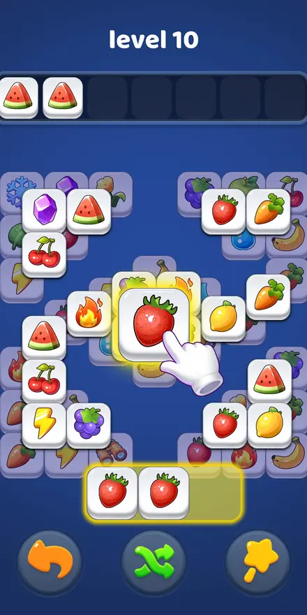 Tabuleiro do Tile Clear com peças de fruta empilhadas e uma bandeja em baixo
